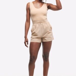 NWT Travis Mathew x Peloton Dawn Glow Tech Woven Romper Medium